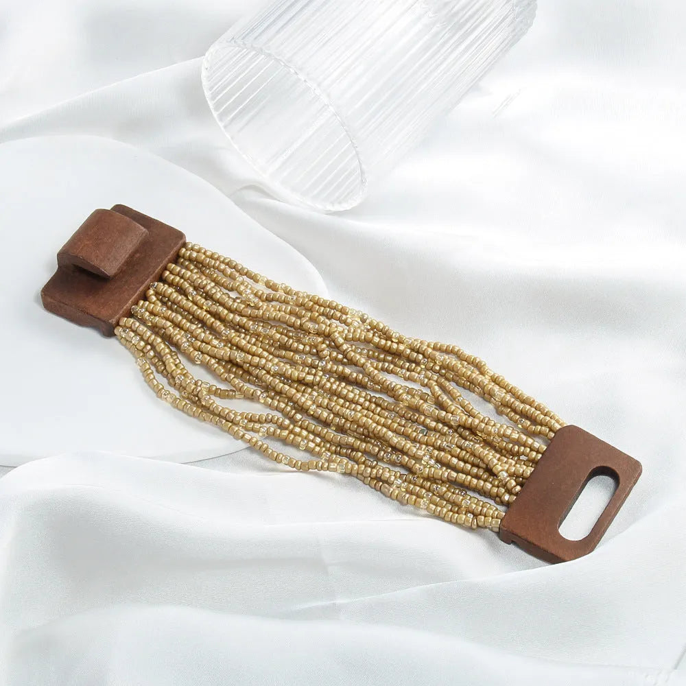 Handmade multi-layer elastic bracelet with rice-shaped glass and coloured glaze beads in geometric quadrilateral pattern, six colour options