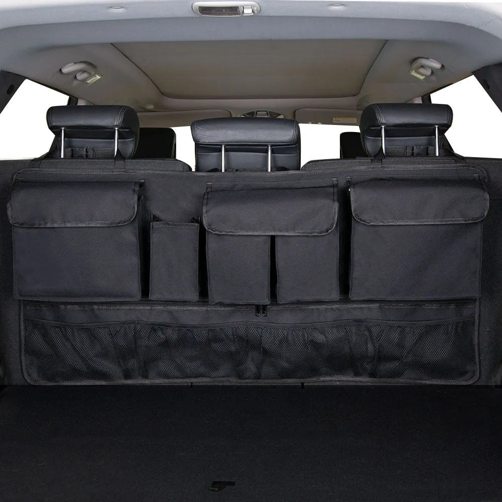 Car boot hanging storage bag made from black Oxford cloth with red piping and handle