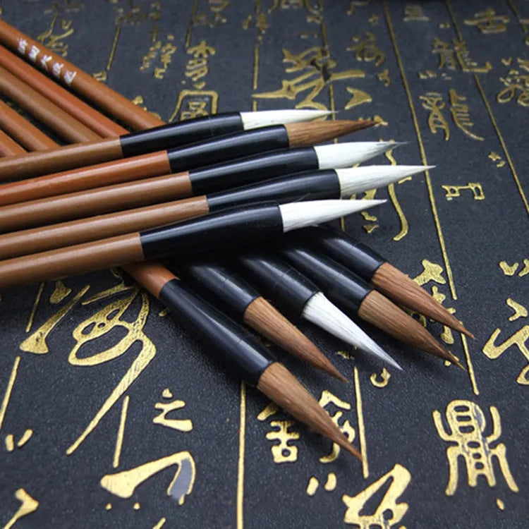 Set of three cloud calligraphy brushes with solid wood handles and round tips in sizes S M L