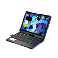Black Bluetooth keyboard case with backlit keys open next to an iPad, showing the 360-degree rotating hinge.