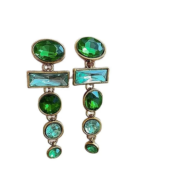 Pair of green gradient geometric ear studs with zircon details and a long tassel, on a white background.