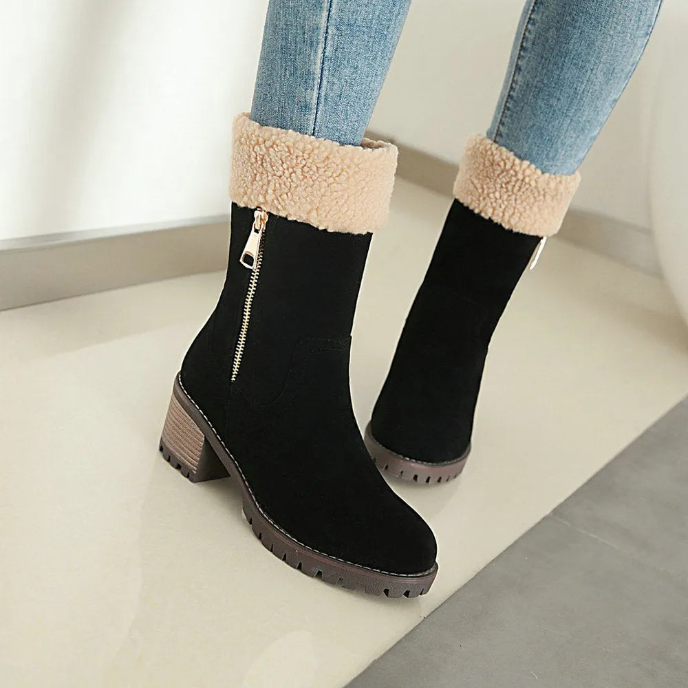 Unisex black snow boots with a rubber sole and plush lining on a white background.