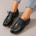 Black women's work shoes with thick rubber heel and soft sole, low top design with European styling