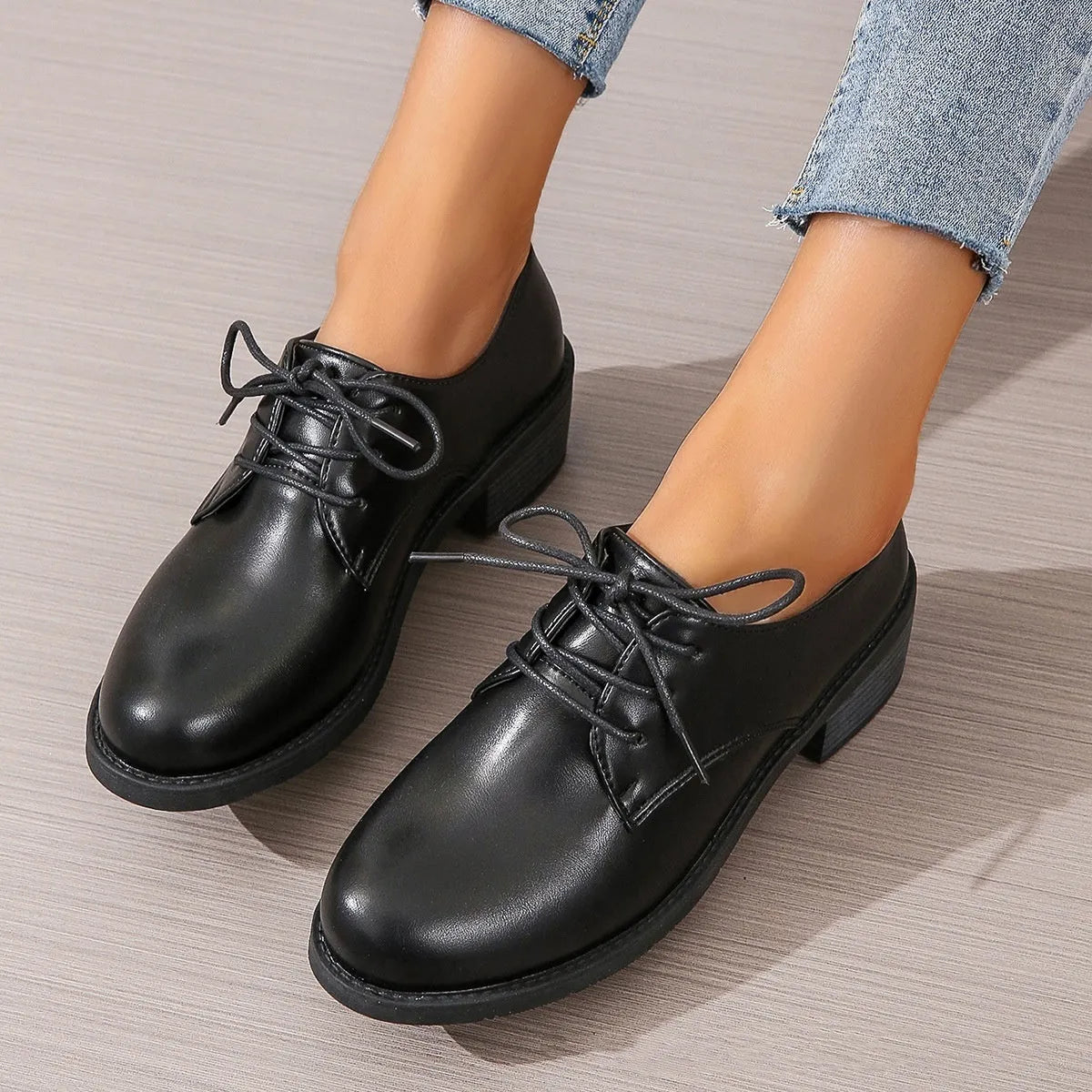 Black women's work shoes with thick rubber heel and soft sole, low top design with European styling