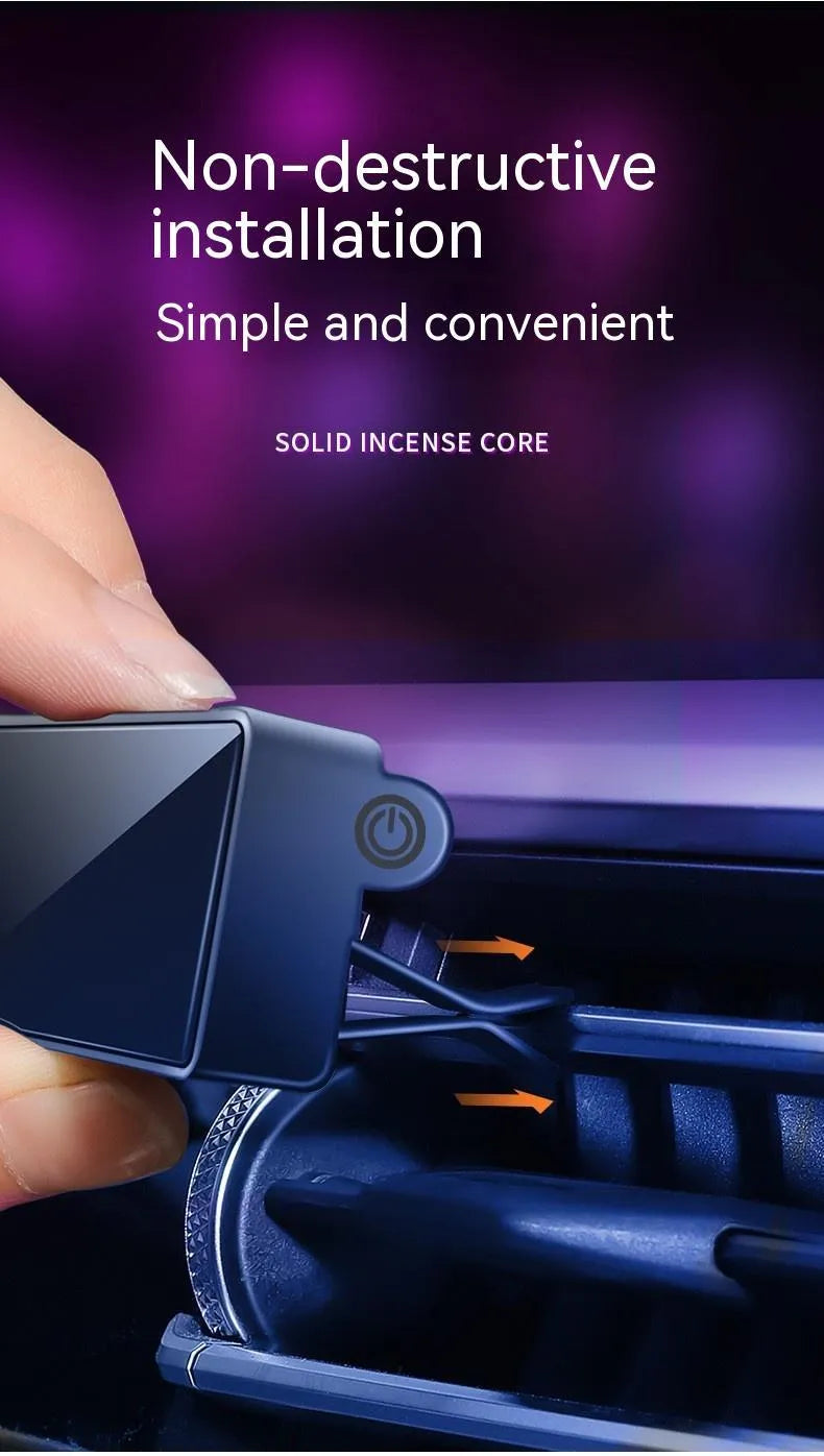 Black car air vent perfume diffuser with LED mood light mounted on vehicle ventilation louvre