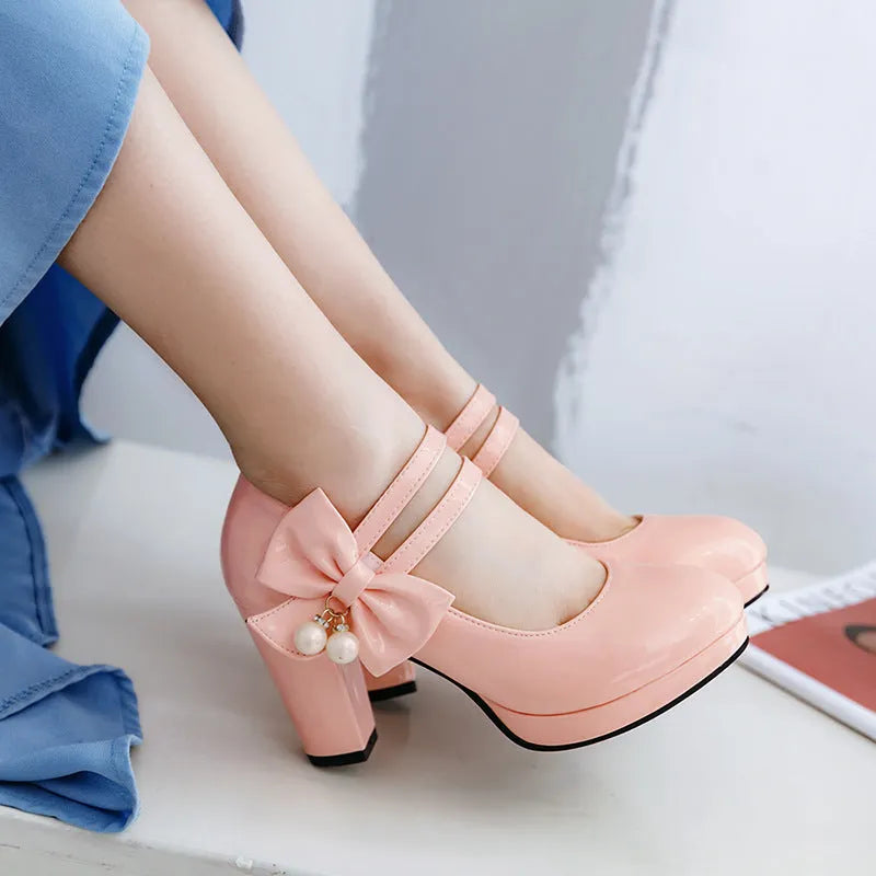 Red platform shoes with chunky heels, round toes, and buckle fastening on waterproof rubber soles