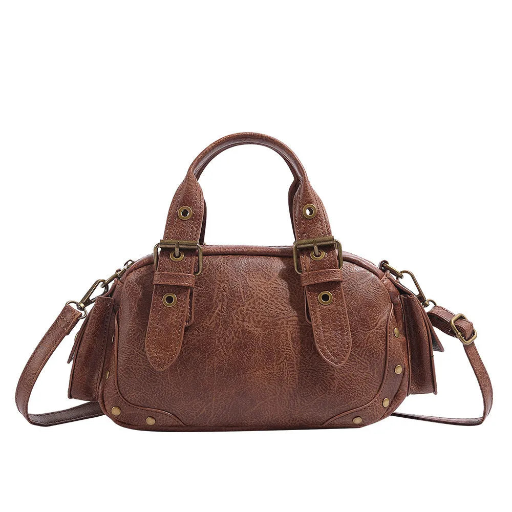 Brown artificial leather motorcycle bag with single shoulder crossbody strap and horizontal square retro shape