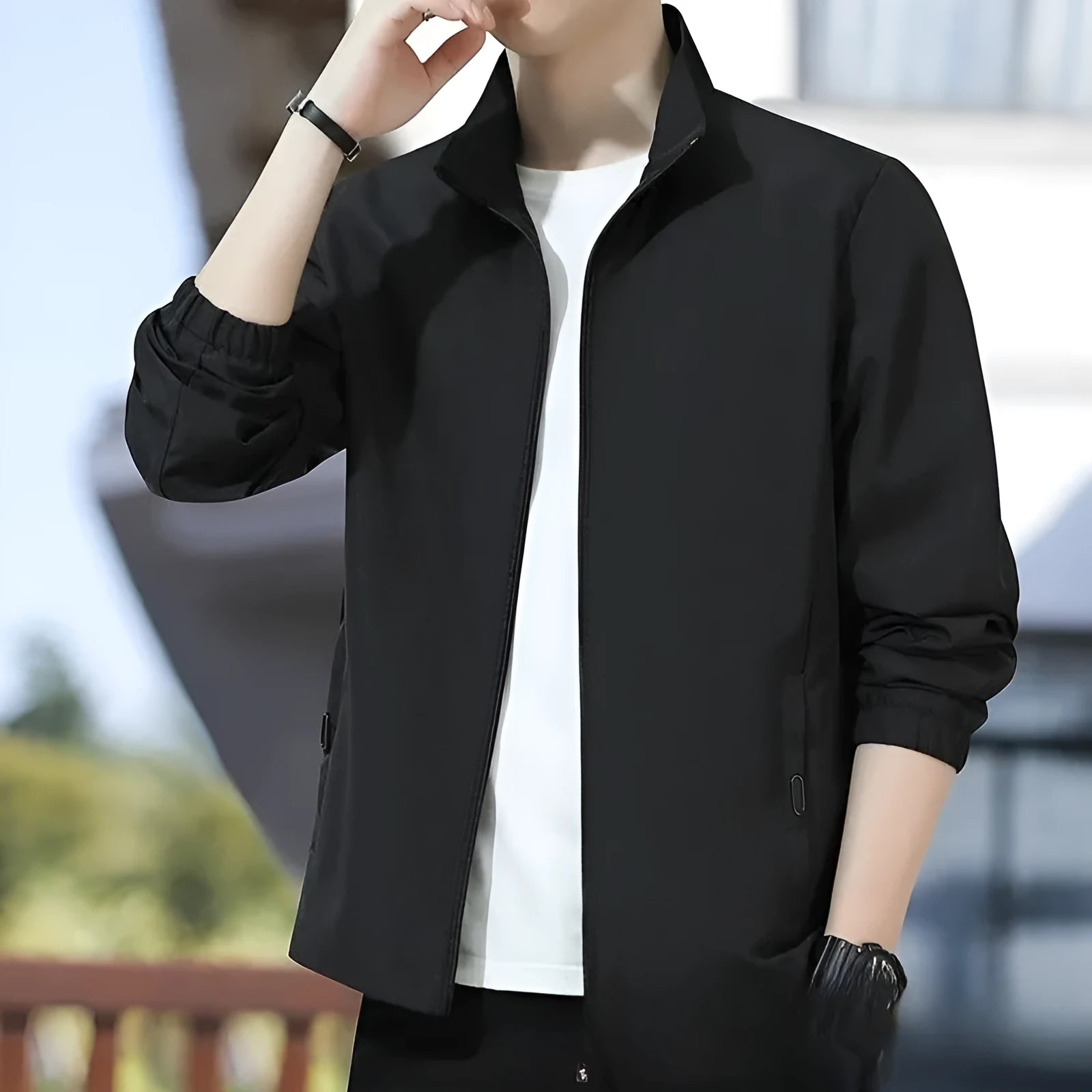 Man wearing a loose-fit grey Korean-style lapel jacket with zipper pockets.