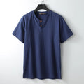 A loose-fitting linen V-neck short sleeve summer top in a choice of colours on a hanger.