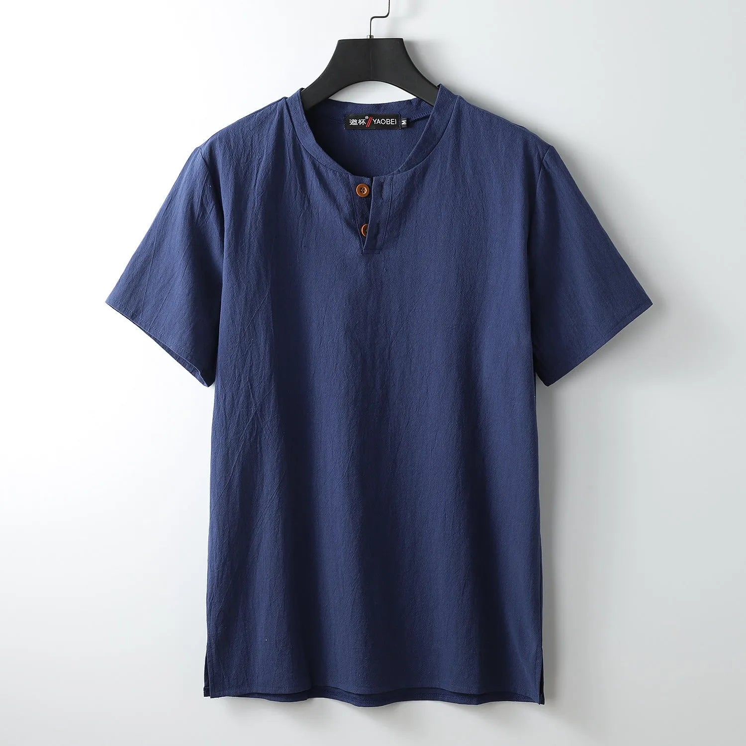 A loose-fitting linen V-neck short sleeve summer top in a choice of colours on a hanger.