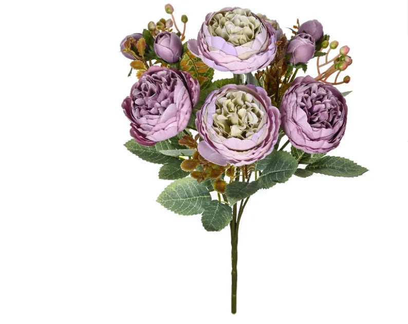Artificial silk peony flower bouquet in a vase, showing layered petals in champagne colour.