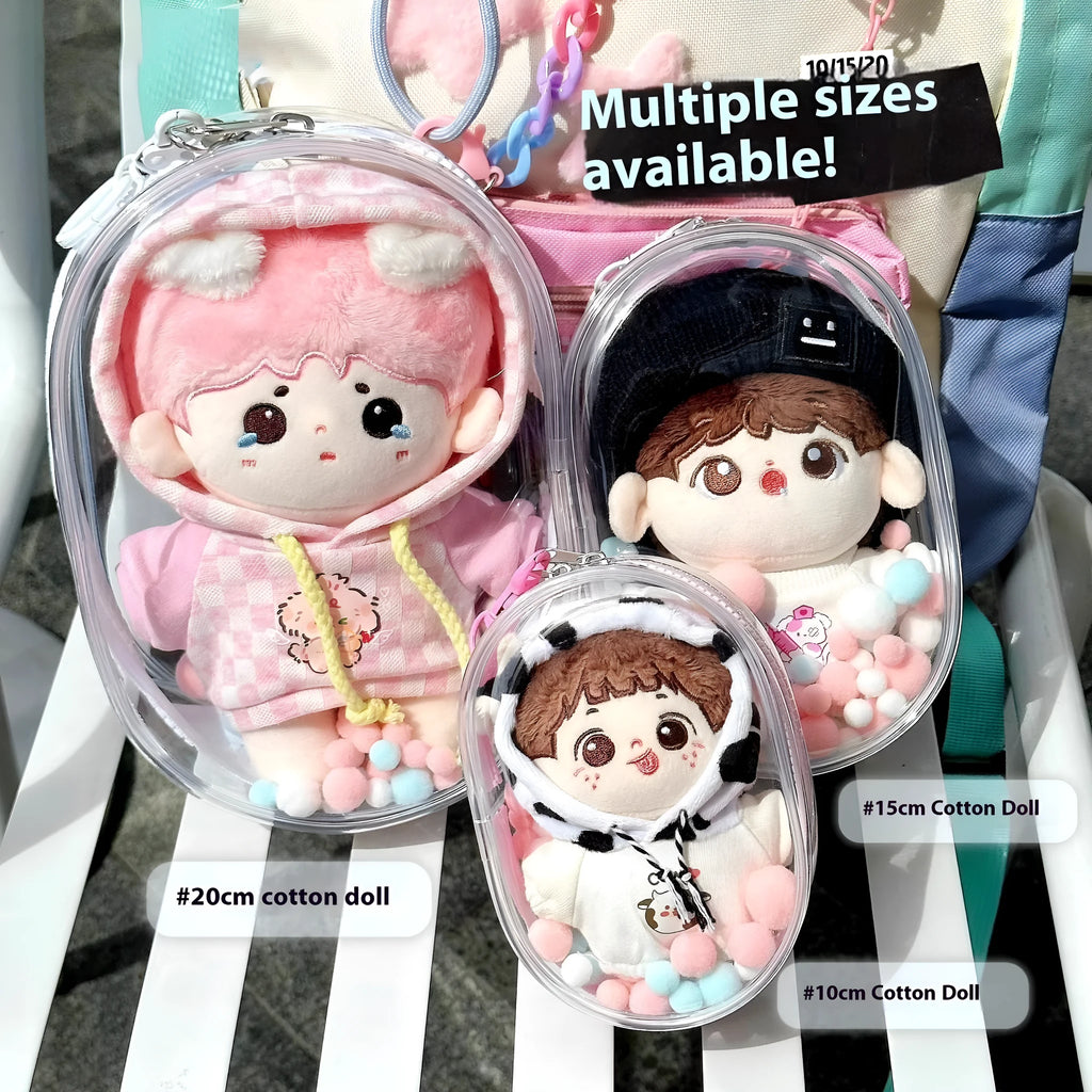 Clear PVC cube-shaped storage bag with colourful ball keychain for cotton dolls and collectibles.