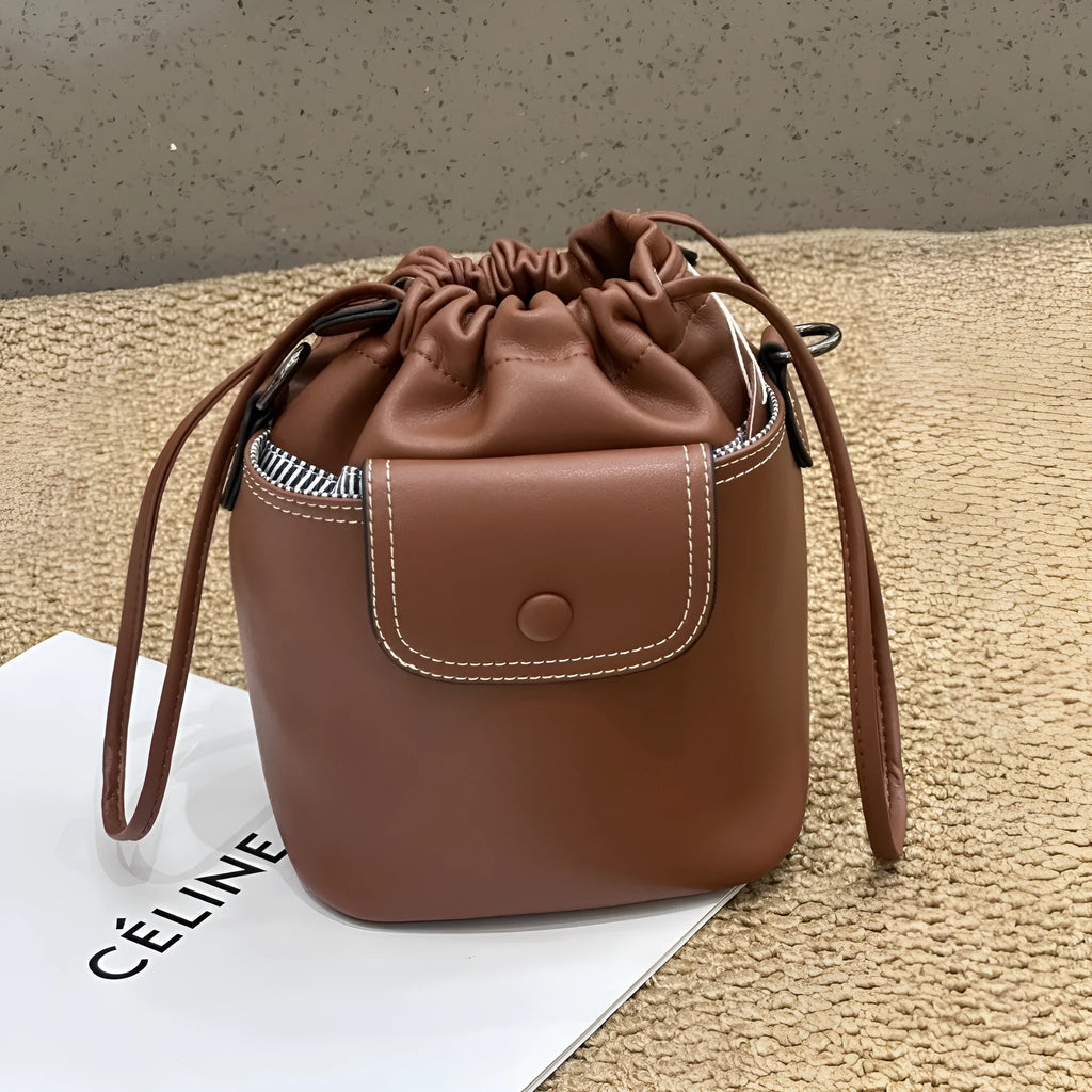 Cortex women's genuine leather bucket crossbody bag in black with drawstring closure and patchwork design, 15 x 20 x 12 cm