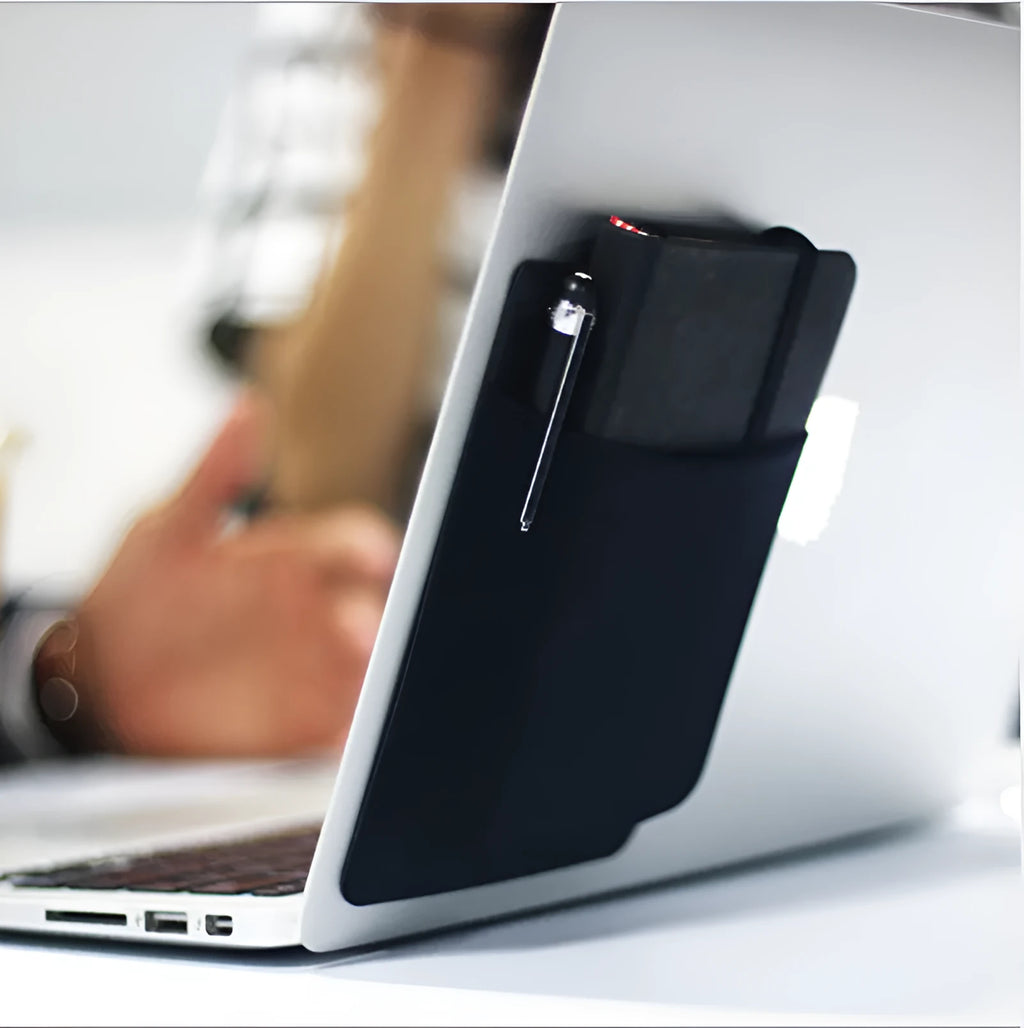Black adhesive Lycra laptop back storage bag 15x12cm with pen loop, attached to laptop showing items inside