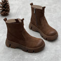 Women's round toe mid heel leather boots in brown with side zipper and rubber sole