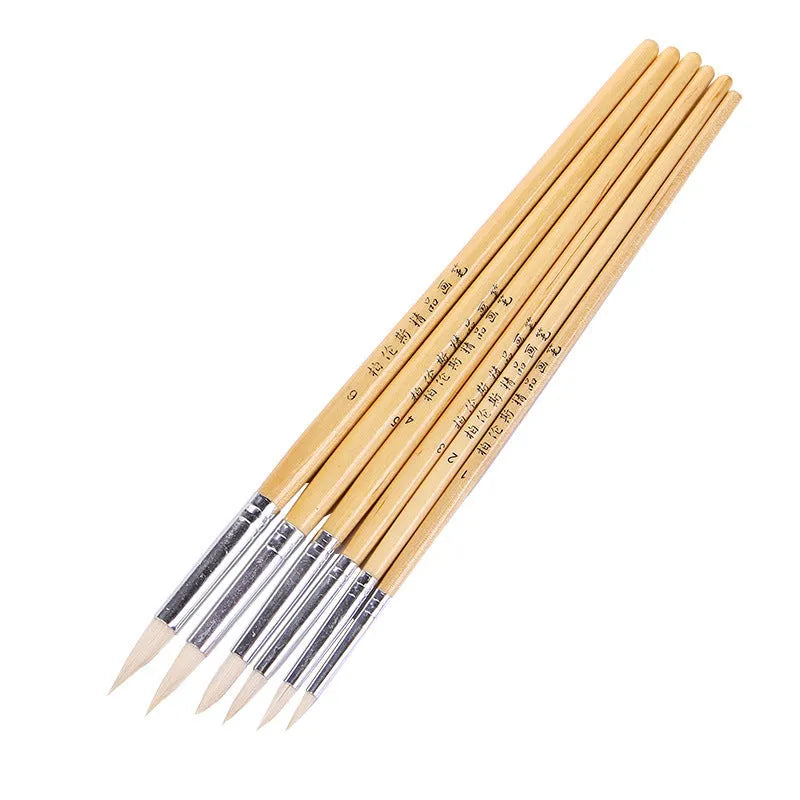 Set of six wooden artistic brushes with pointed wool tips for line work and calligraphy