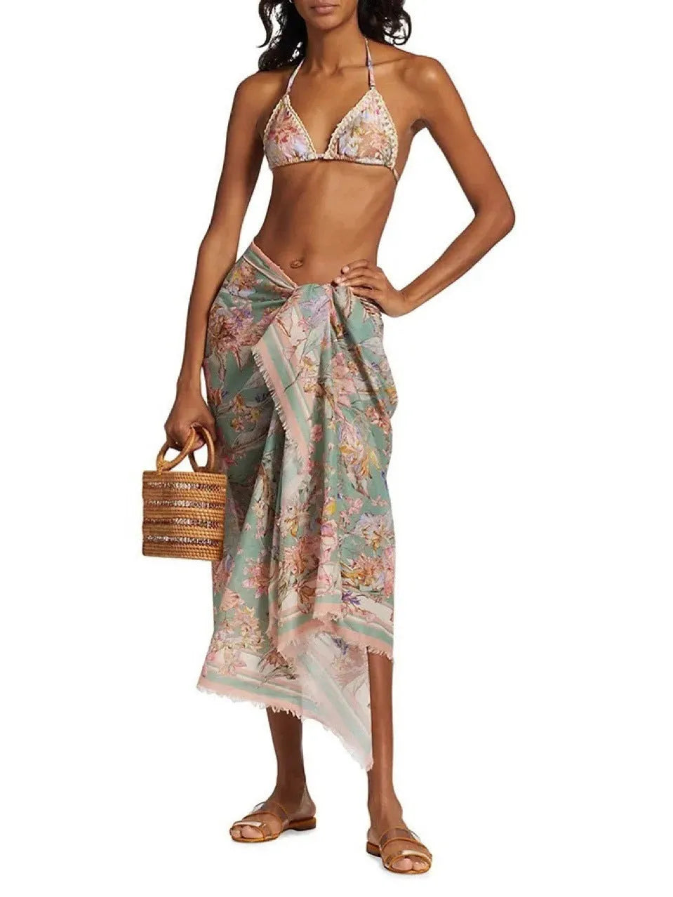 Women's creamy-white floral bikini swimsuit with separate top, underwear, and skirt pieces