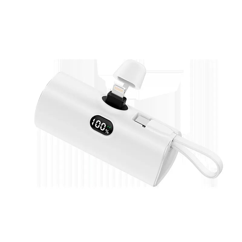 Capsule-shaped wireless power bank with UK plug and digital display in five colours.