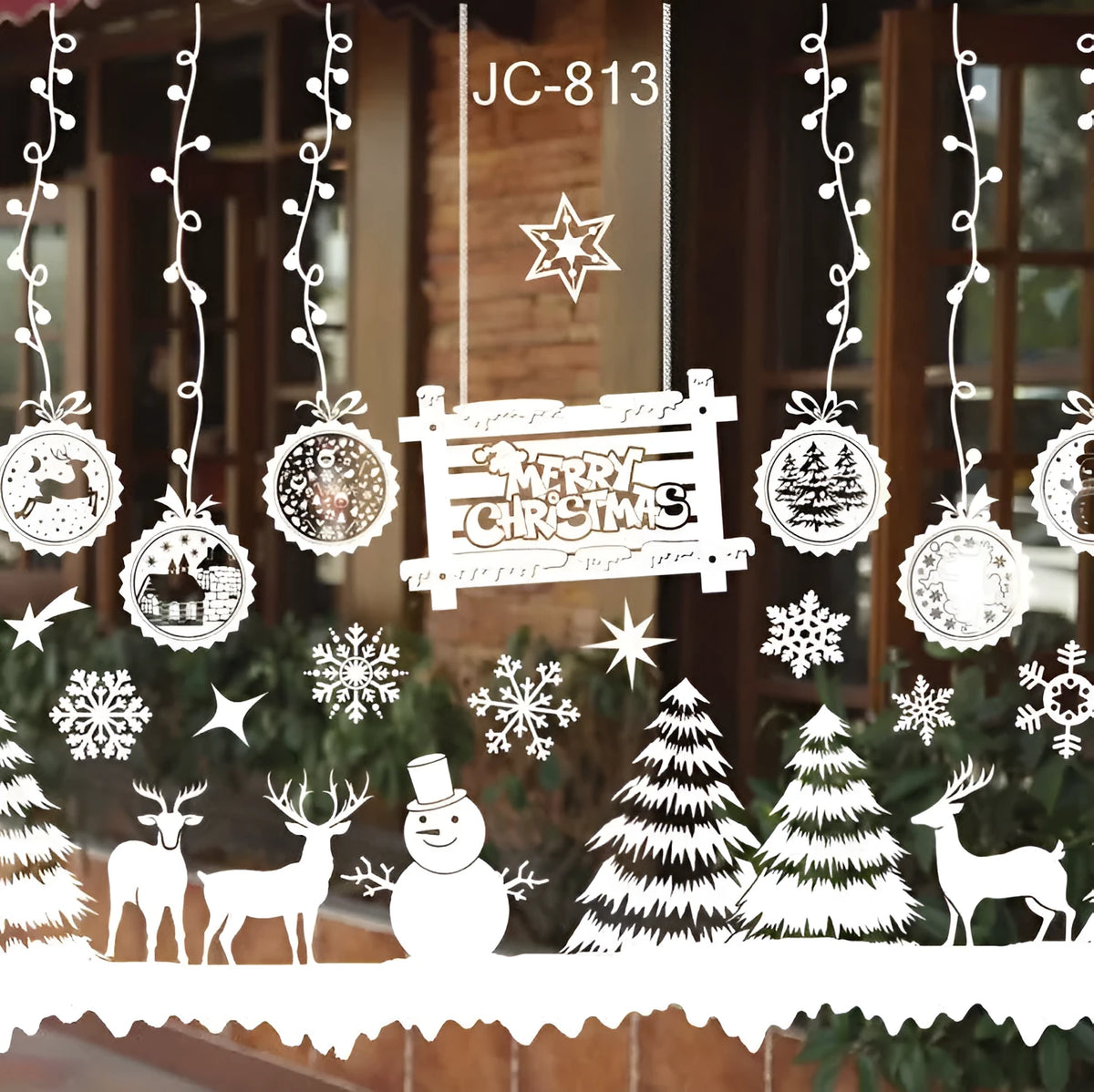 Roll of Christmas window stickers in PVC, white, with two sheets and a 50cm x 35.3cm unfolded layout.
