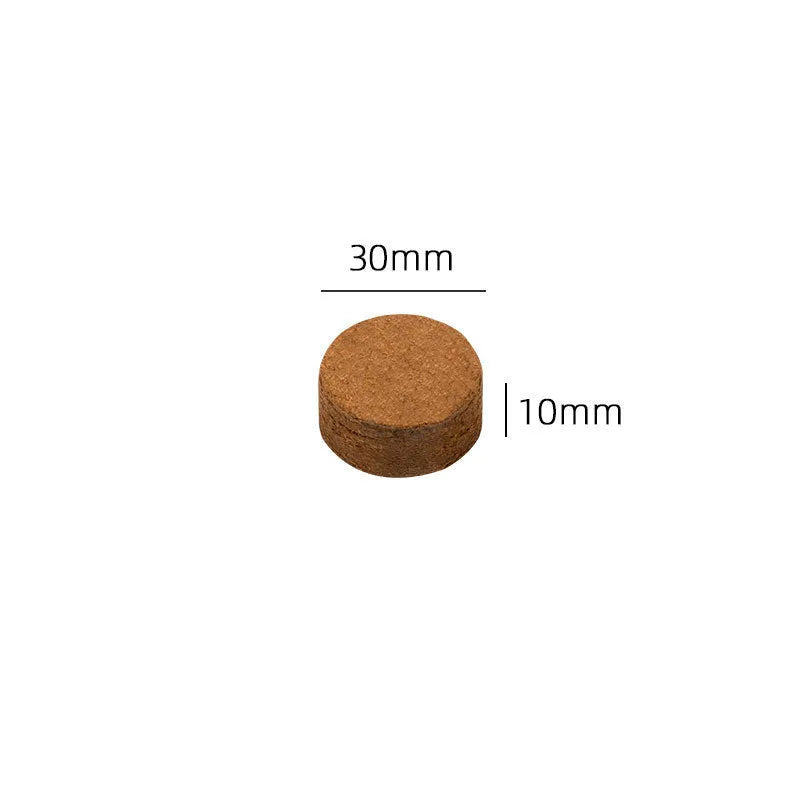 Assorted sizes of dry, round, brown compressed nutrient soil blocks for vegetable planting and seedlings.