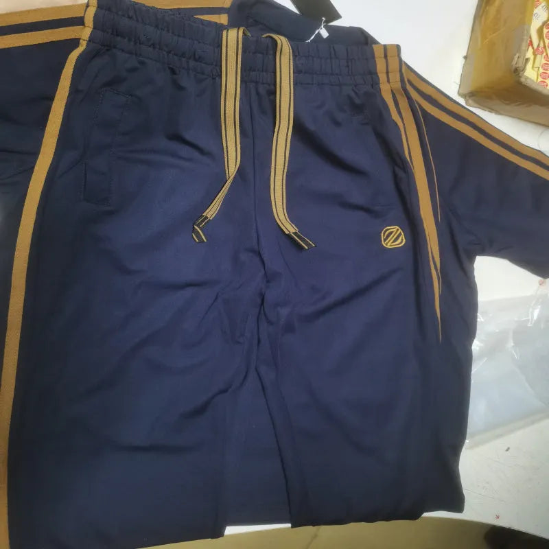Man wearing a blue ice silk style short sleeve tracksuit set, showing the top and pants.