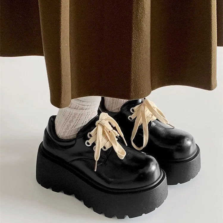 Matte black women's lace-up shoes with a thick rubber sole and a 6-8cm English muffin heel.