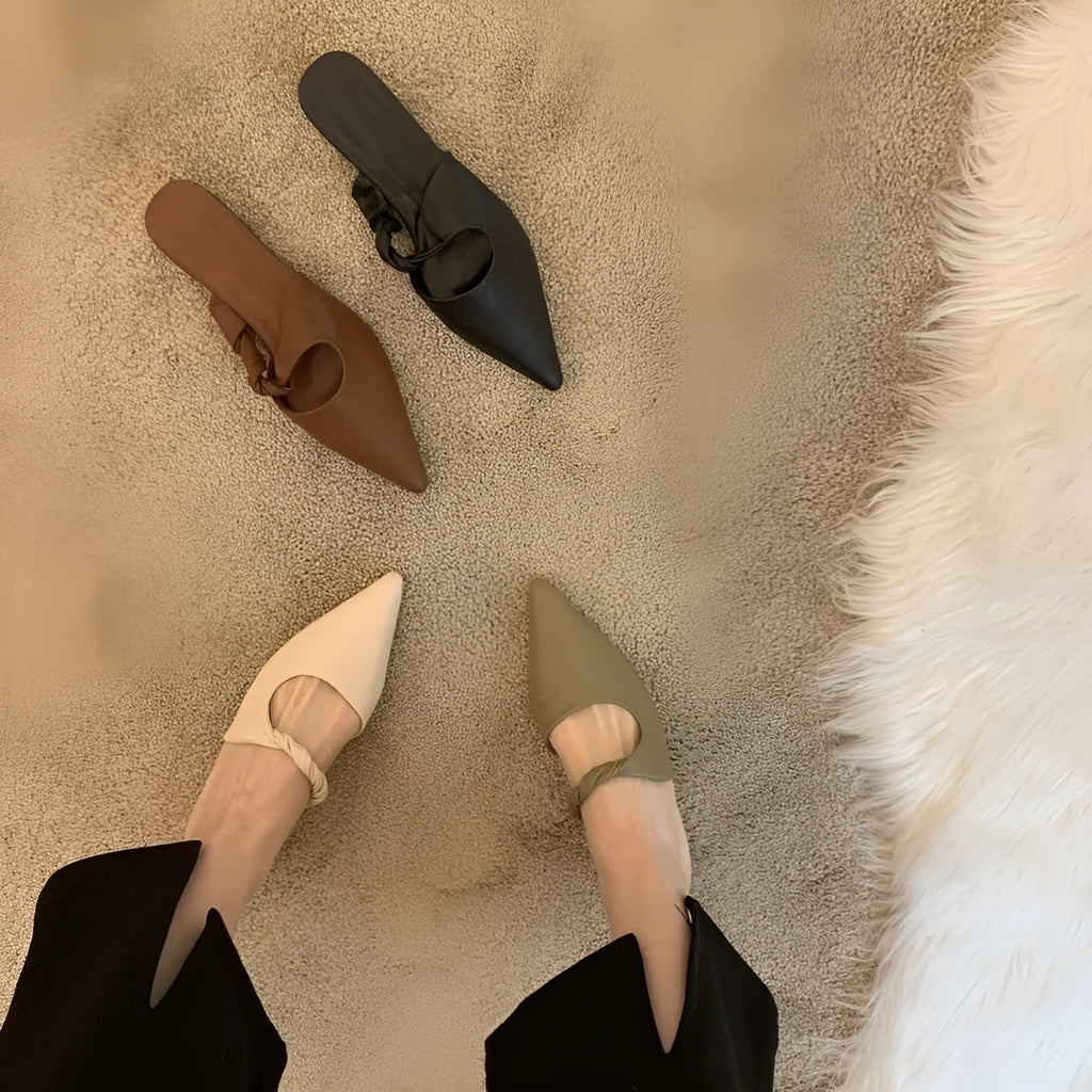 Women's soft leather-lined semi-toe box slippers with a rubber sole in dark brown.