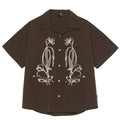Brown striped men's short sleeve outdoor shirt with Cuban collar on a mannequin.