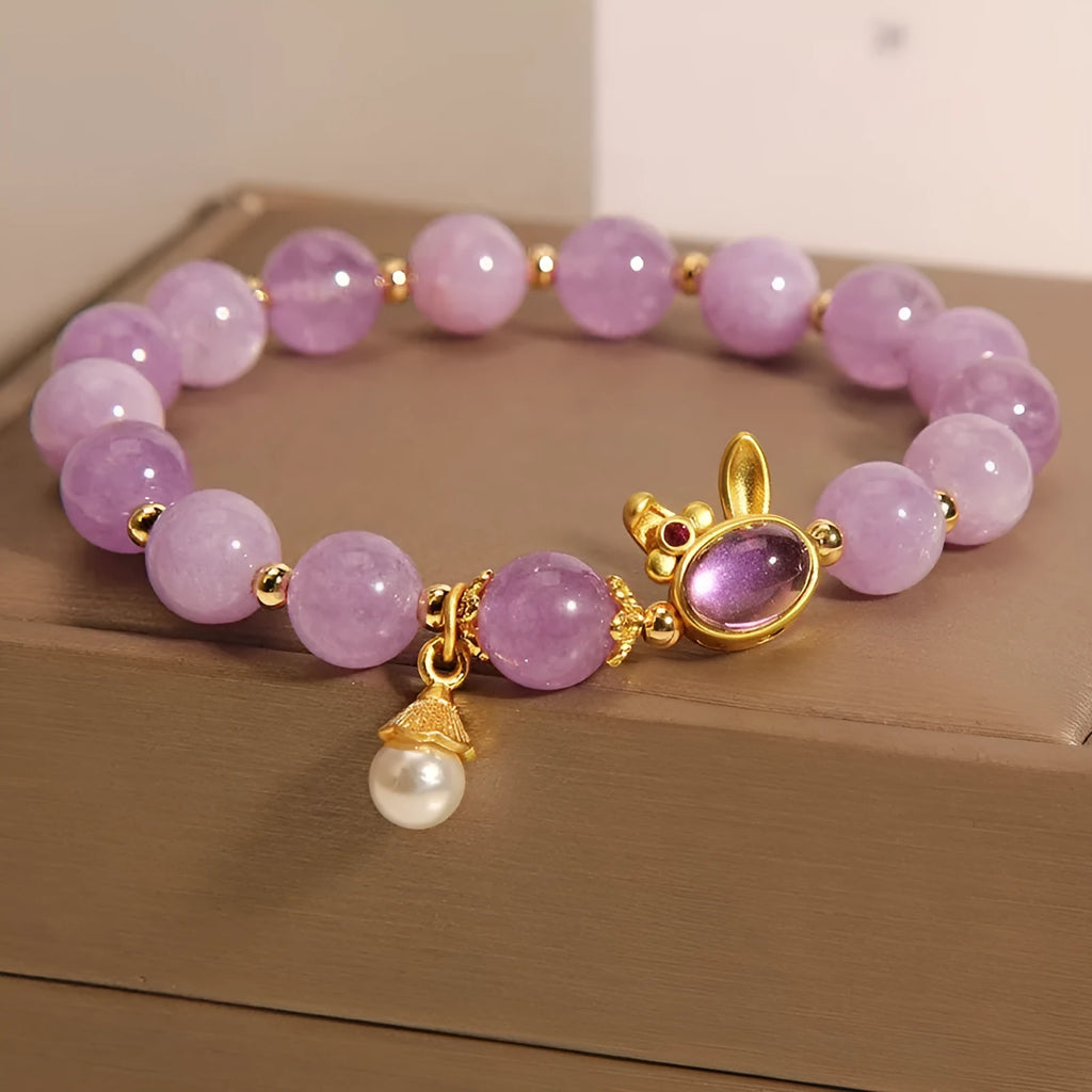 Mauve jade hare head pendant on a clear crystal bracelet, Mori style design.