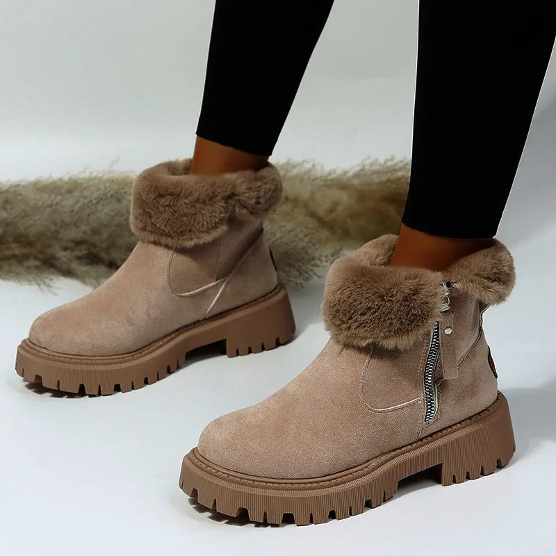 Women's black faux suede high-top snow boot with side zipper on a non-slip rubber sole.