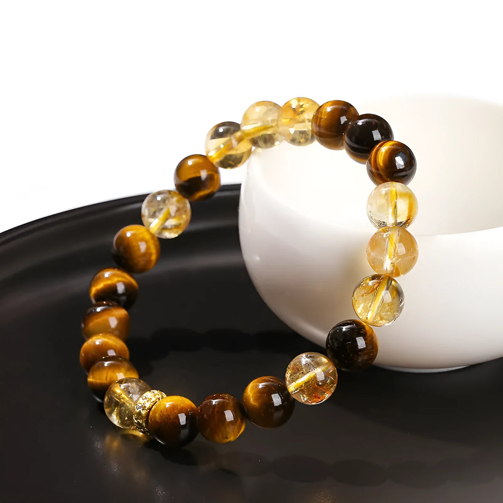 Natural yellow tiger's eye crystal bracelet with mixed yellow tower charms on wrist