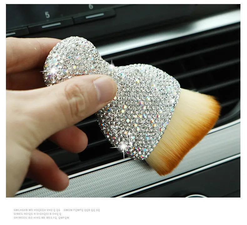 Compact white PVC soft-bristle brush for cleaning car dashboard vents and interior dust.