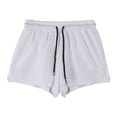 Man wearing black quick-drying nylon summer shorts in a sports leisure style.