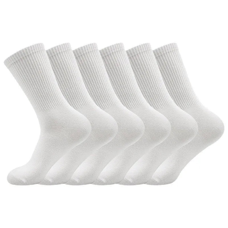 Mid-calf length sports socks in black, white, and grey colours