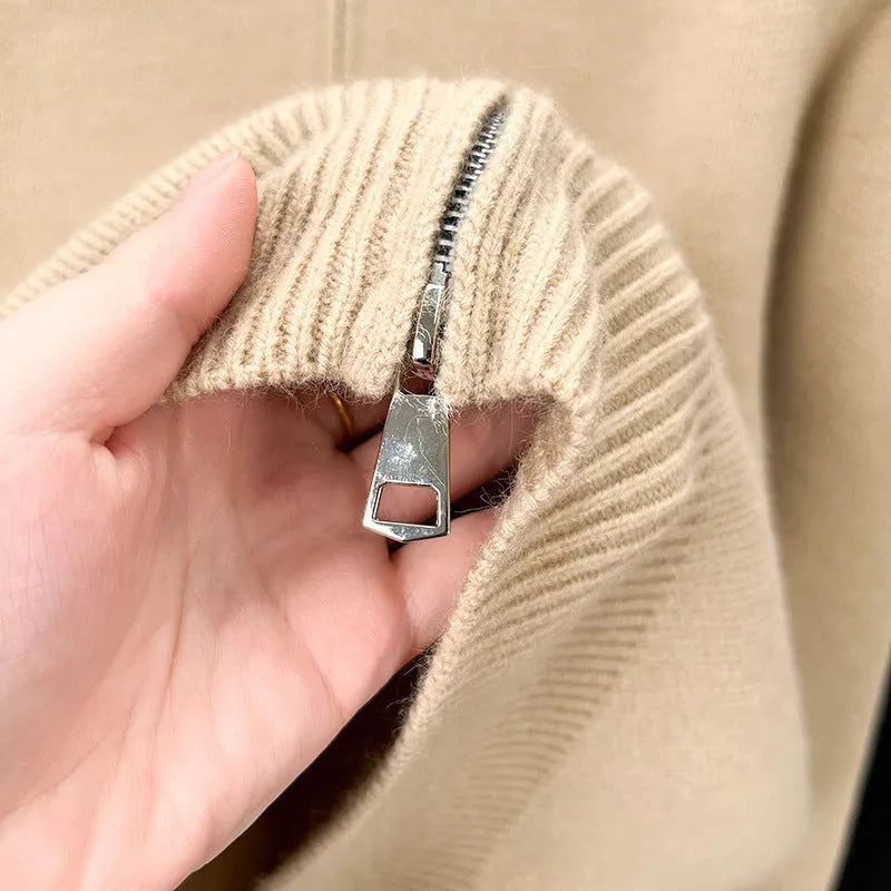 Men's black knitted zip-up cardigan with a stand collar, shown in a loose fit.