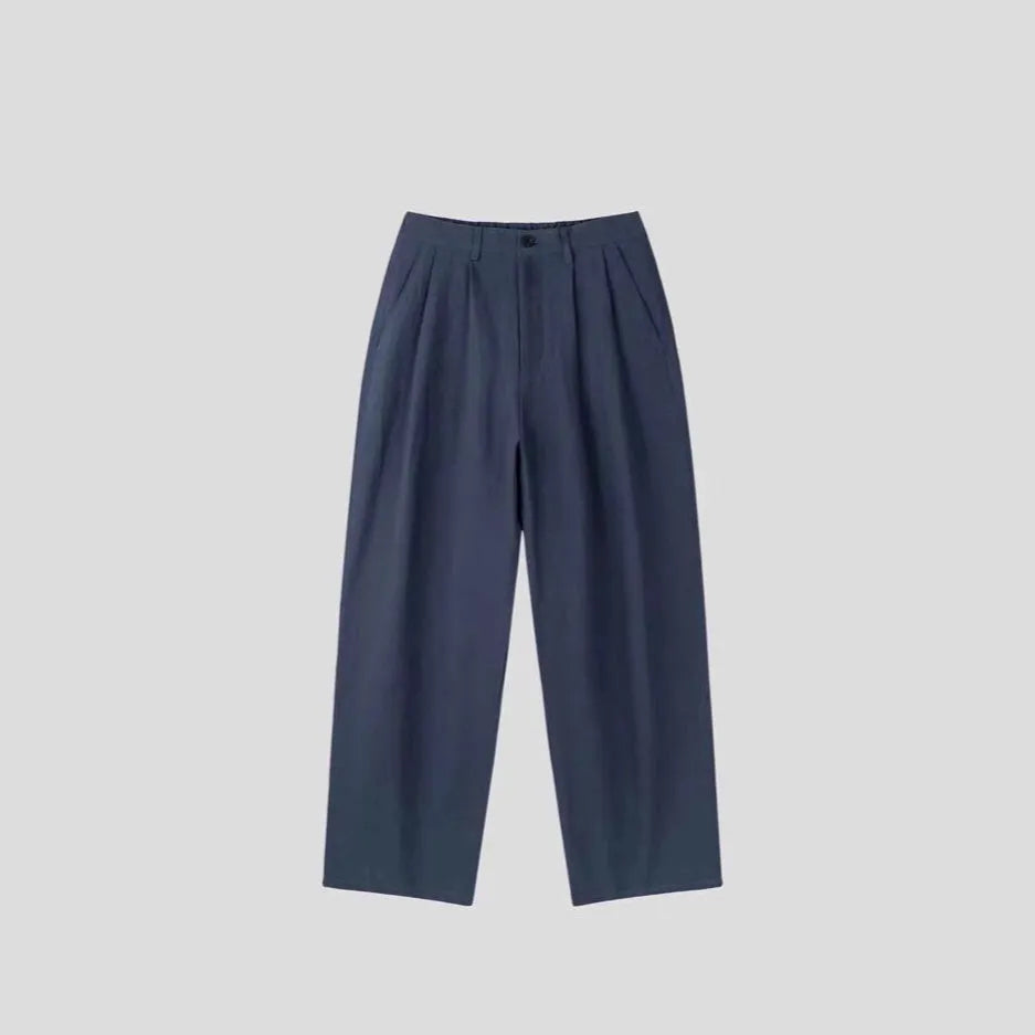Men's loose-fit apricot coloured cotton linen blend trousers with a straight leg and elastic waistband.