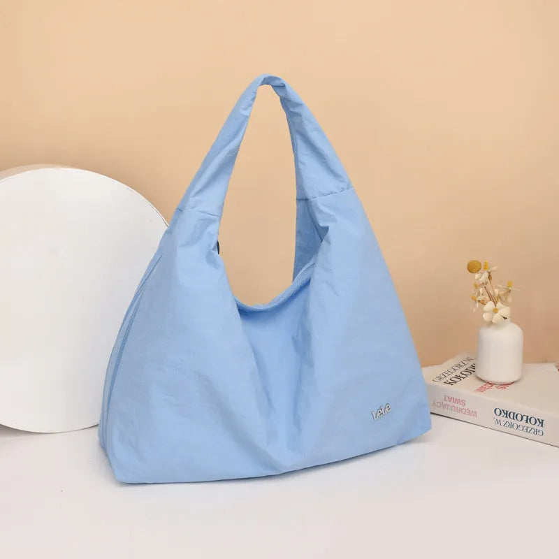 Heart-shaped nylon underarm bag for women in black, blue, khaki, or yellow colour options
