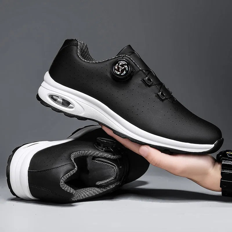 Black and white low-top mesh casual tennis shoes with cross shoulder straps and a flat sole.