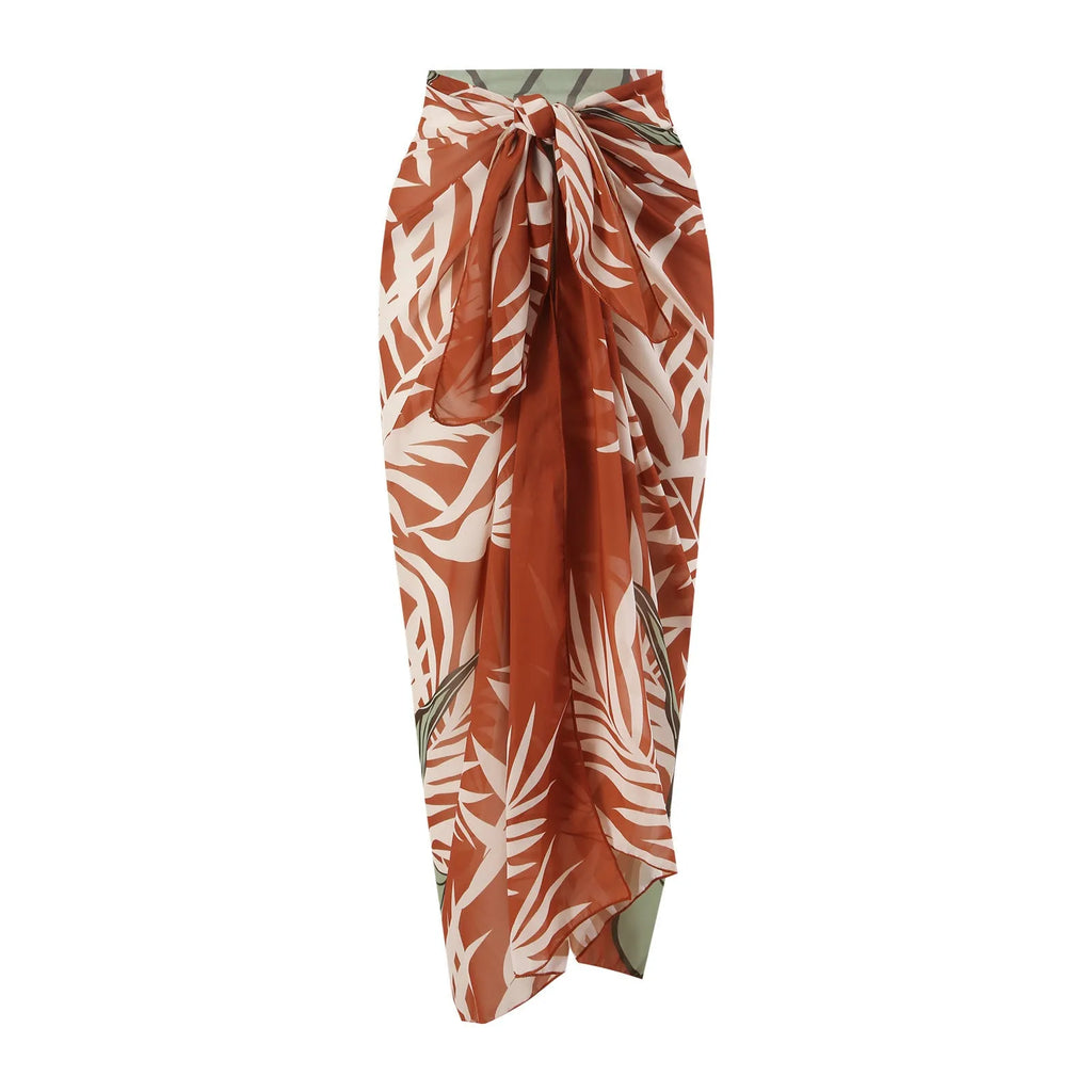 Women's brown high waist bikini with a sheer chiffon dress overlay attached.