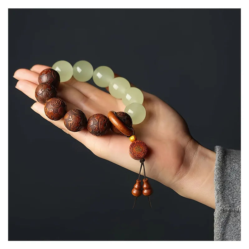 Wooden bracelet with carved Amass Fortunes character on rosewood segments