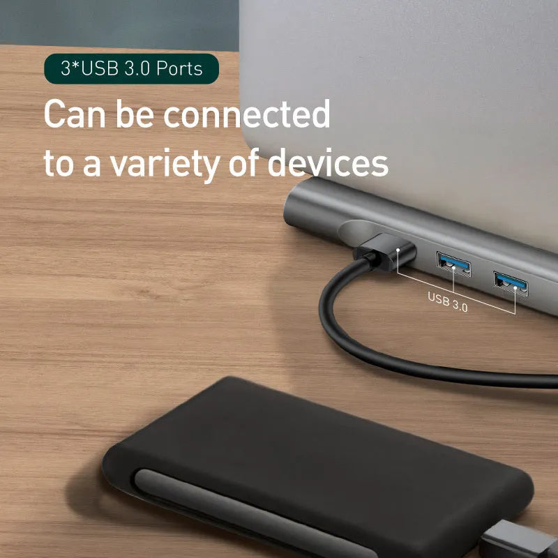 Grey aluminium ten-port docking station with cooling bracket showing HDMI, VGA and USB ports