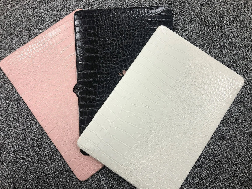 MacBook protective case with crocodile pattern texture and hollowed-out Apple logo in soft pink colour