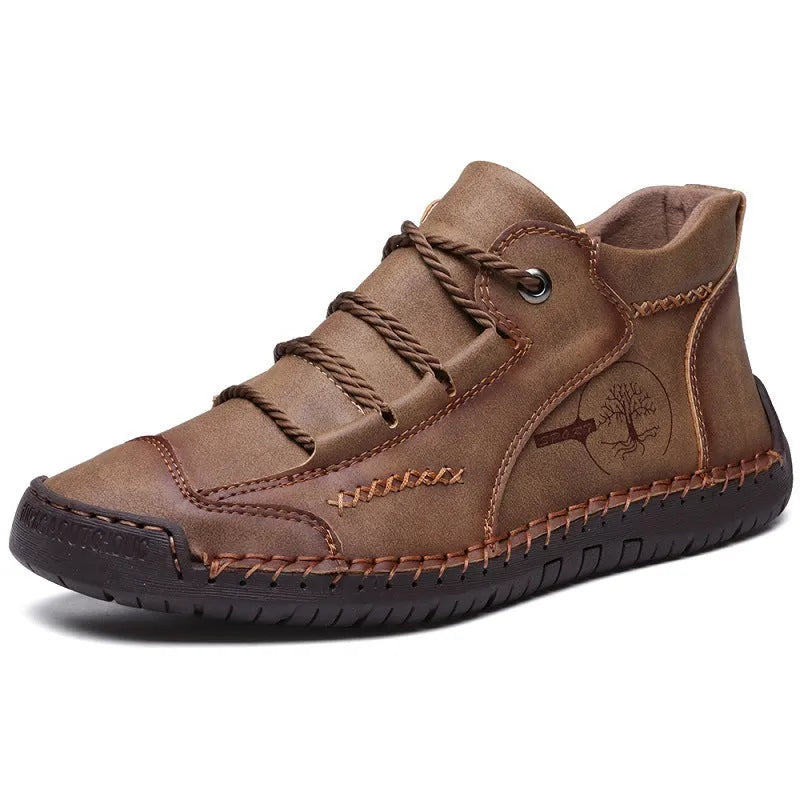 Men's brown leather high-top boots with visible stitching and flat rubber sole on a neutral background.