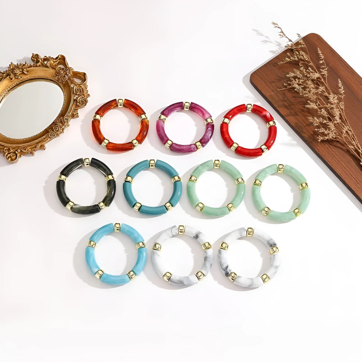Acrylic bent tube bracelet in ten colours including black, blue, red, green, purple and white grey.