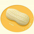 Yellow peanut-shaped dog chew toy with textured surface and squeaker