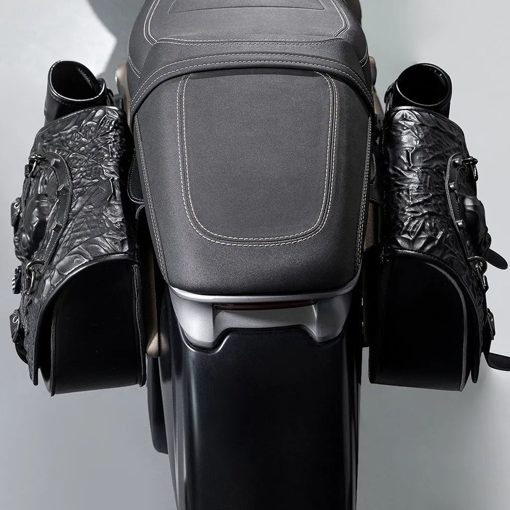 Pair of black PU leather motorcycle modified side luggage bags mounted on a bike.