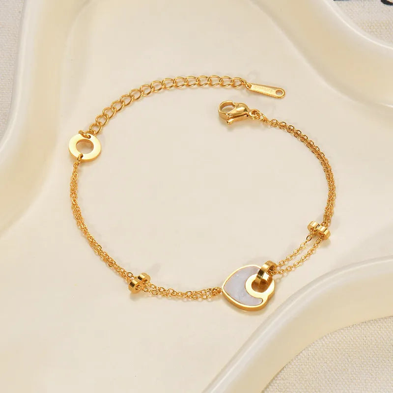 Women's stainless steel resin bracelet with a double-layer heart shape design.