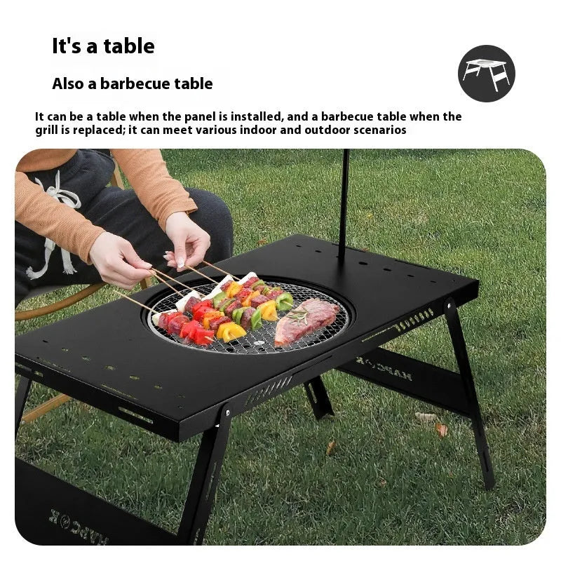 Folding black camping cooking tea table that functions as both barbecue stove and dining surface