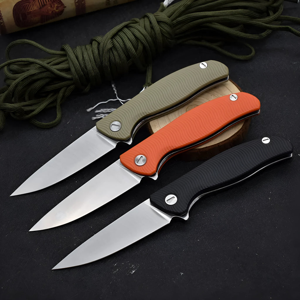 Outdoor folding knife with D2 steel blade, 9.6 cm blade length, 4.0 mm edge thickness, and nylon glass fibre handle in Black or Orange