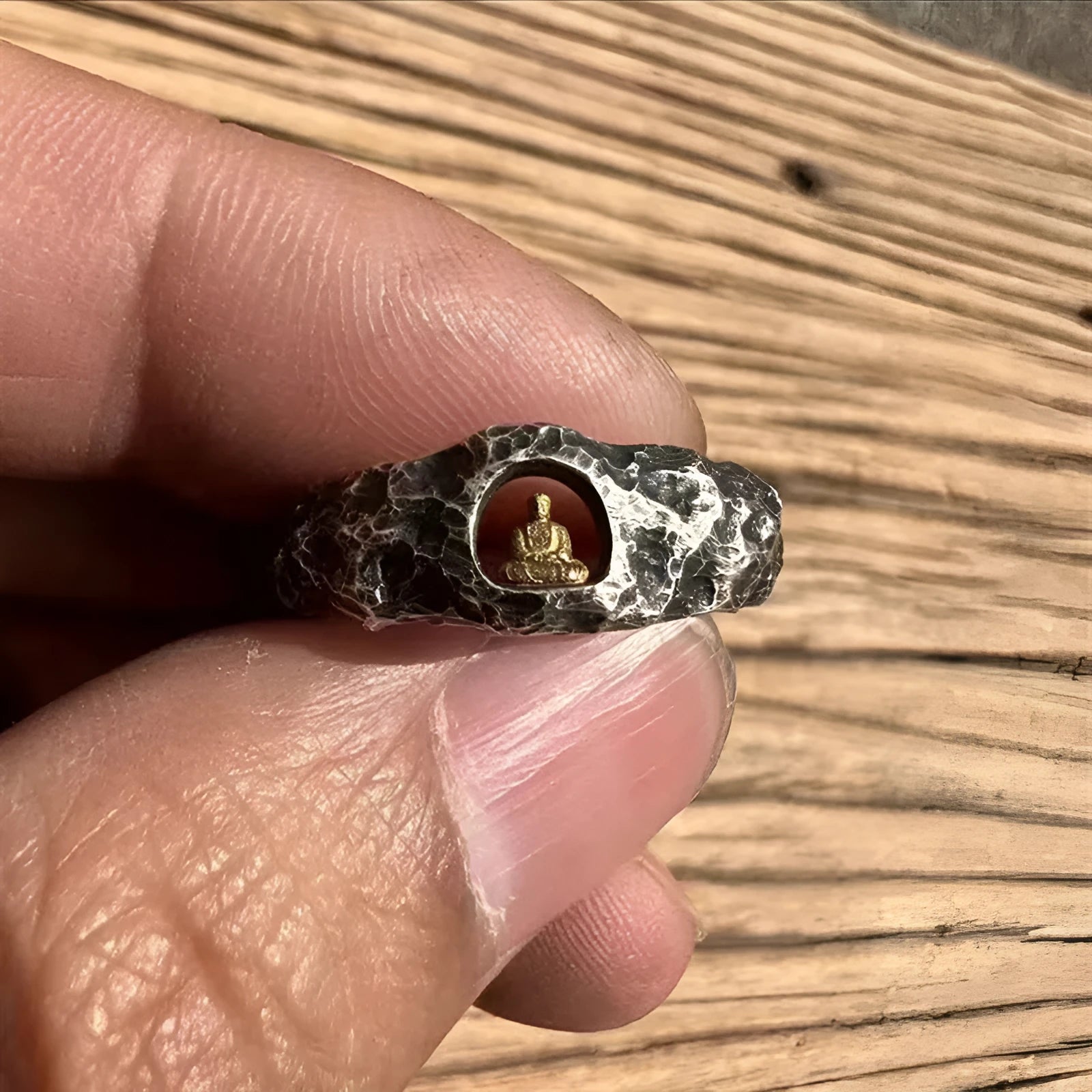 Hand-forged copper Grotto Buddha ring with a rock texture surface, shown in size no. 8.